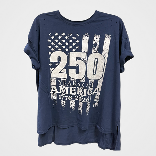 A navy blue short-sleeve t-shirt with a distressed American flag graphic and '250 YEARS OF AMERICA 1776-2026' printed on the front, displayed against a light gray background.