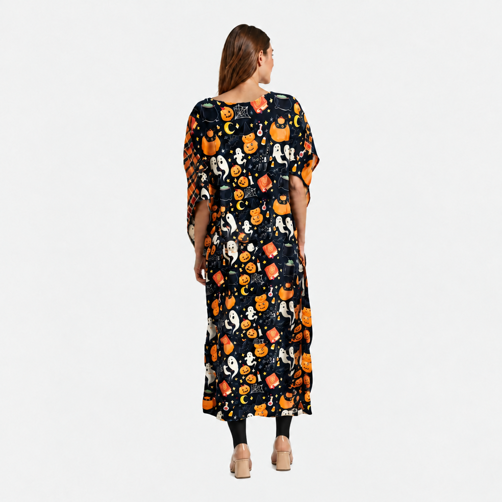Woman wearing a Halloween-themed dress with pumpkins and ghosts on a white background