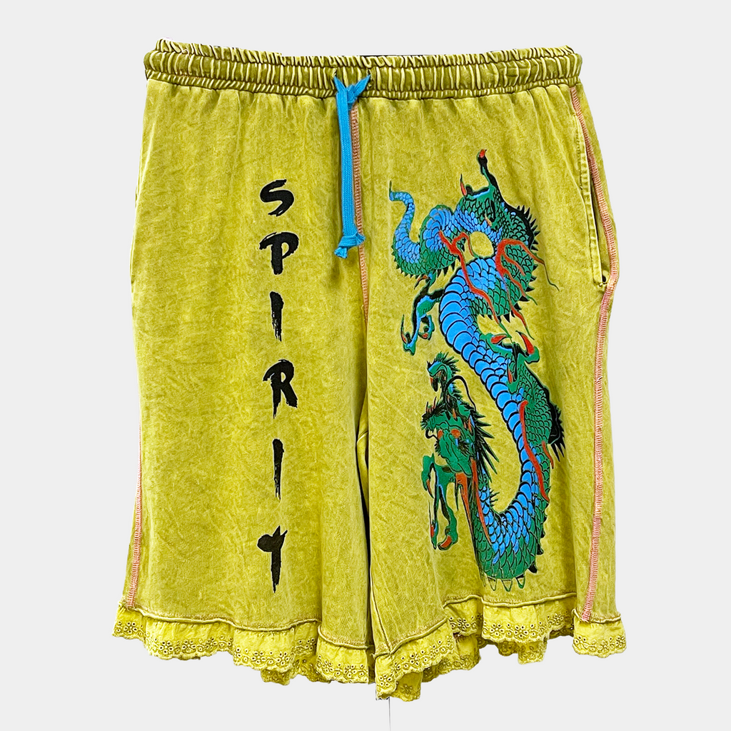 Chartreuse athletic shorts with a blue drawstring, featuring a large embroidered blue dragon on the right leg and the word 'SPIRIT' embroidered vertically in black on the left leg.