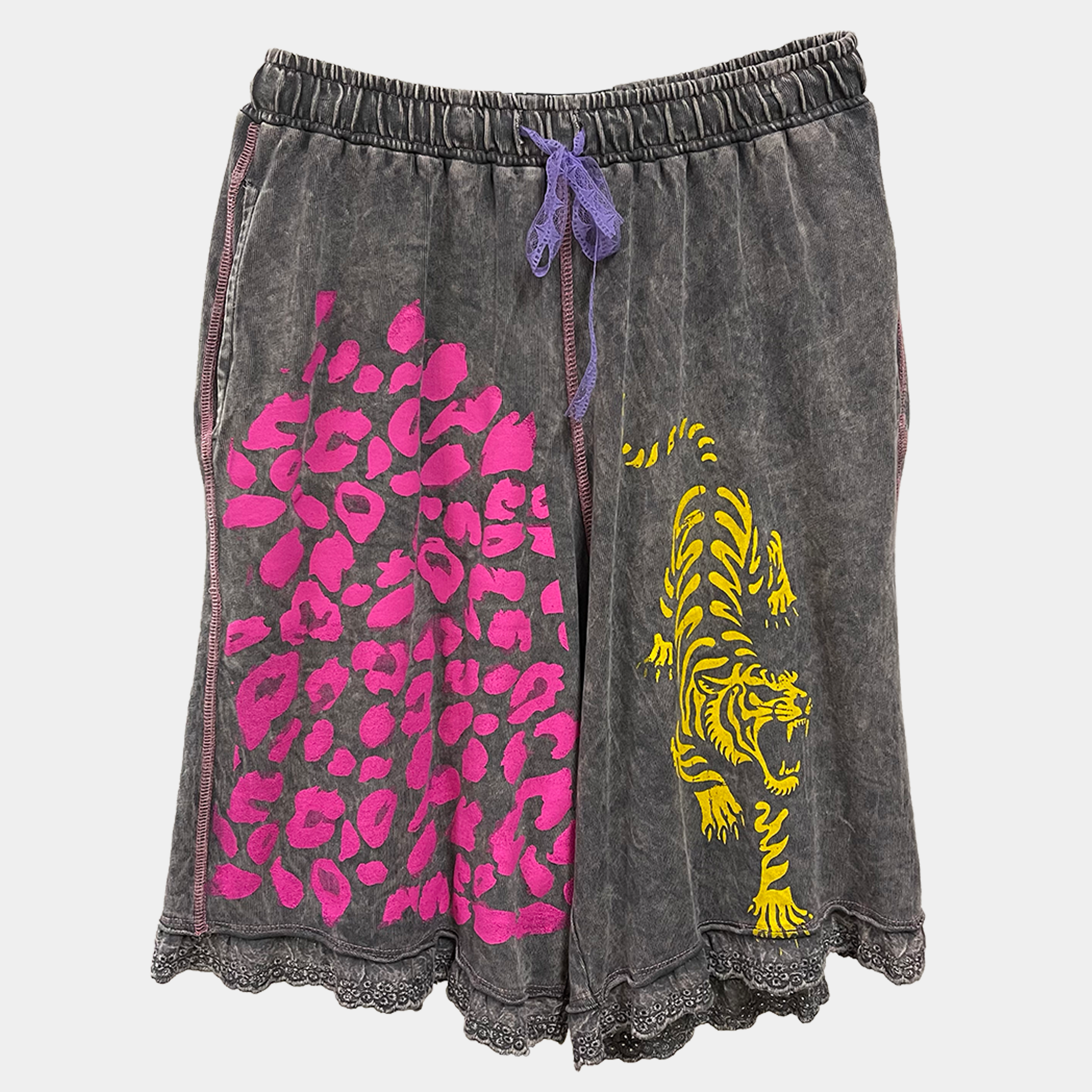 Gray shorts with pink leopard print and yellow tiger design on a light gray background