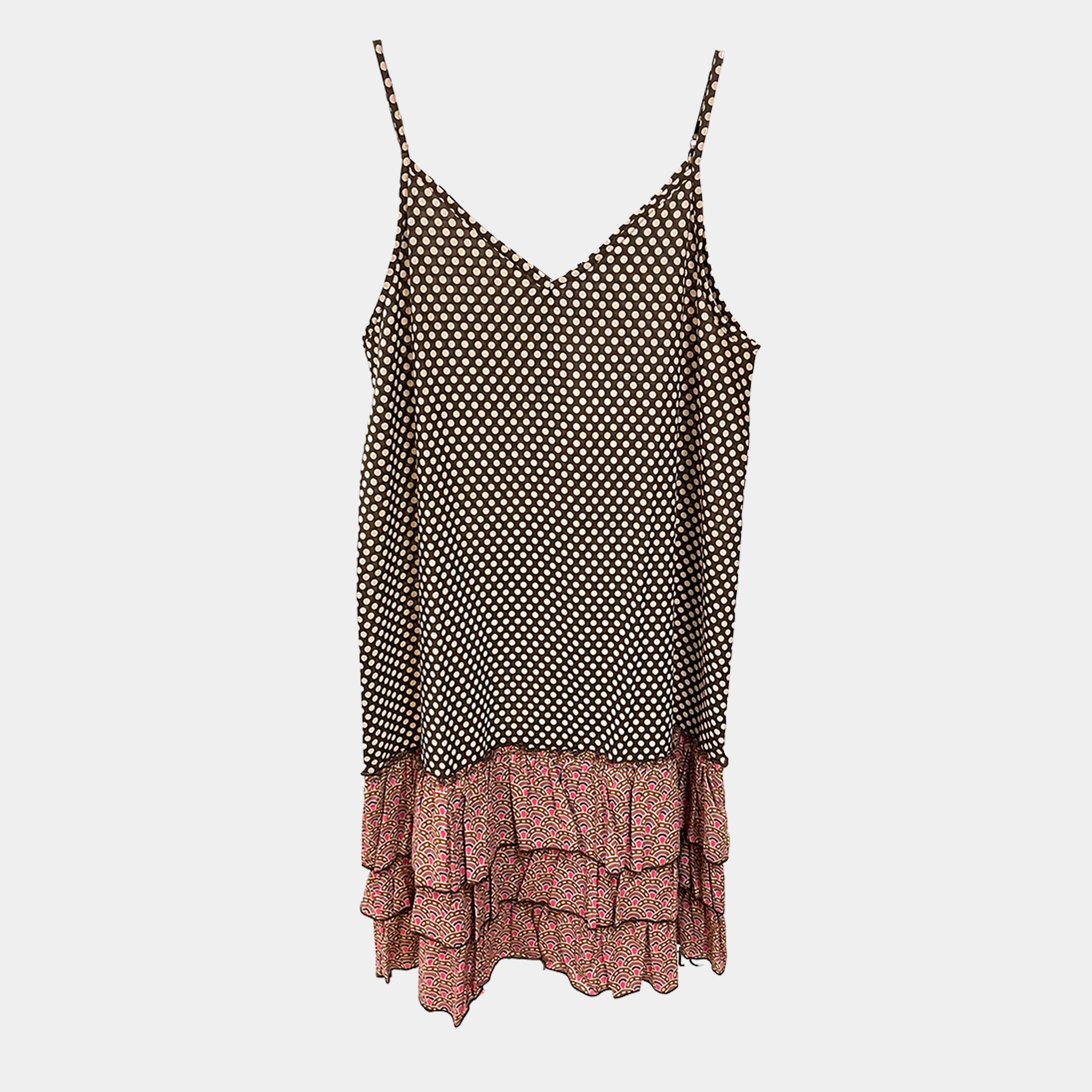 Polka dot top with ruffled skirt on a light gray background