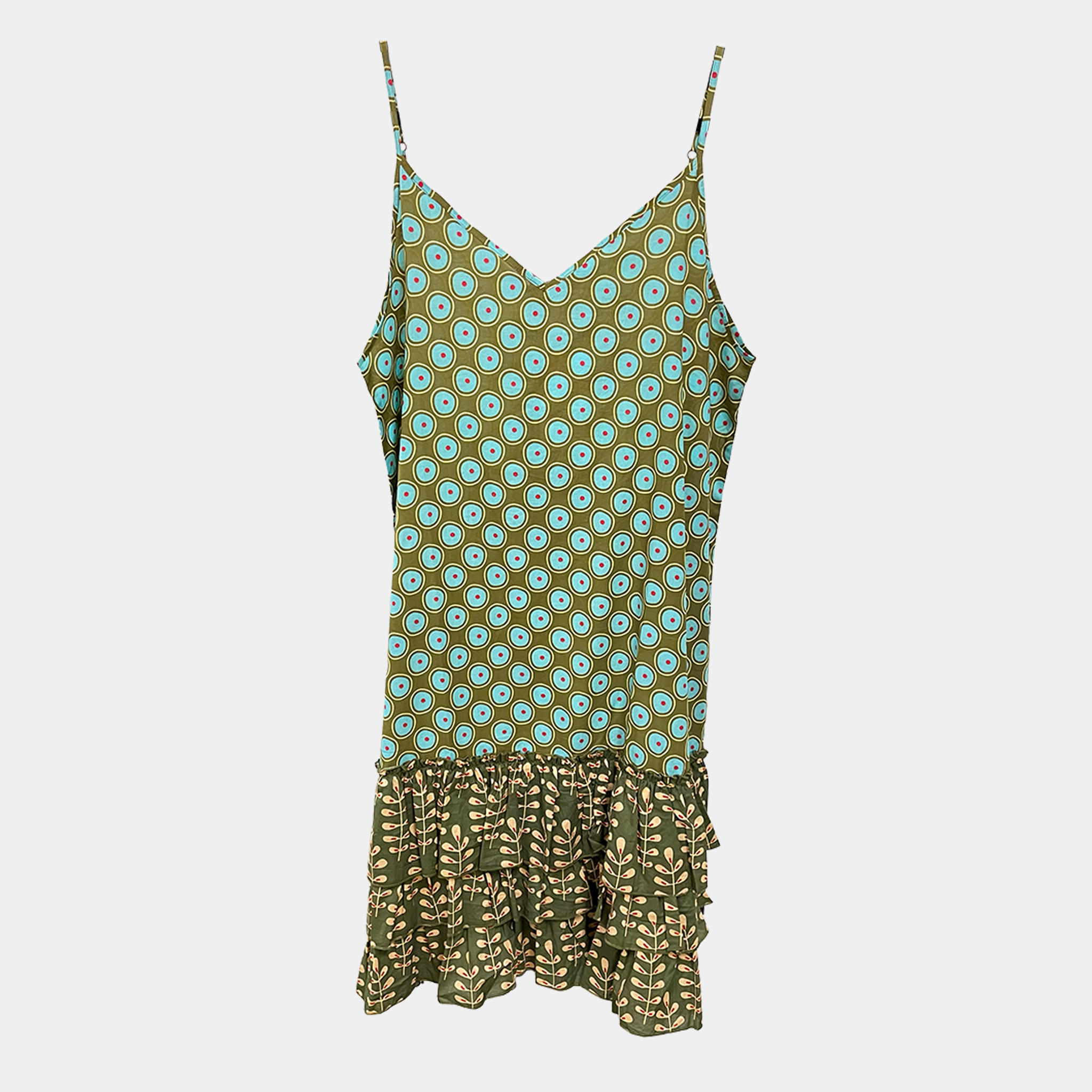 Green and blue patterned dress on a light gray background
